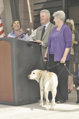 Two bill signings mark dog day at the Legislature